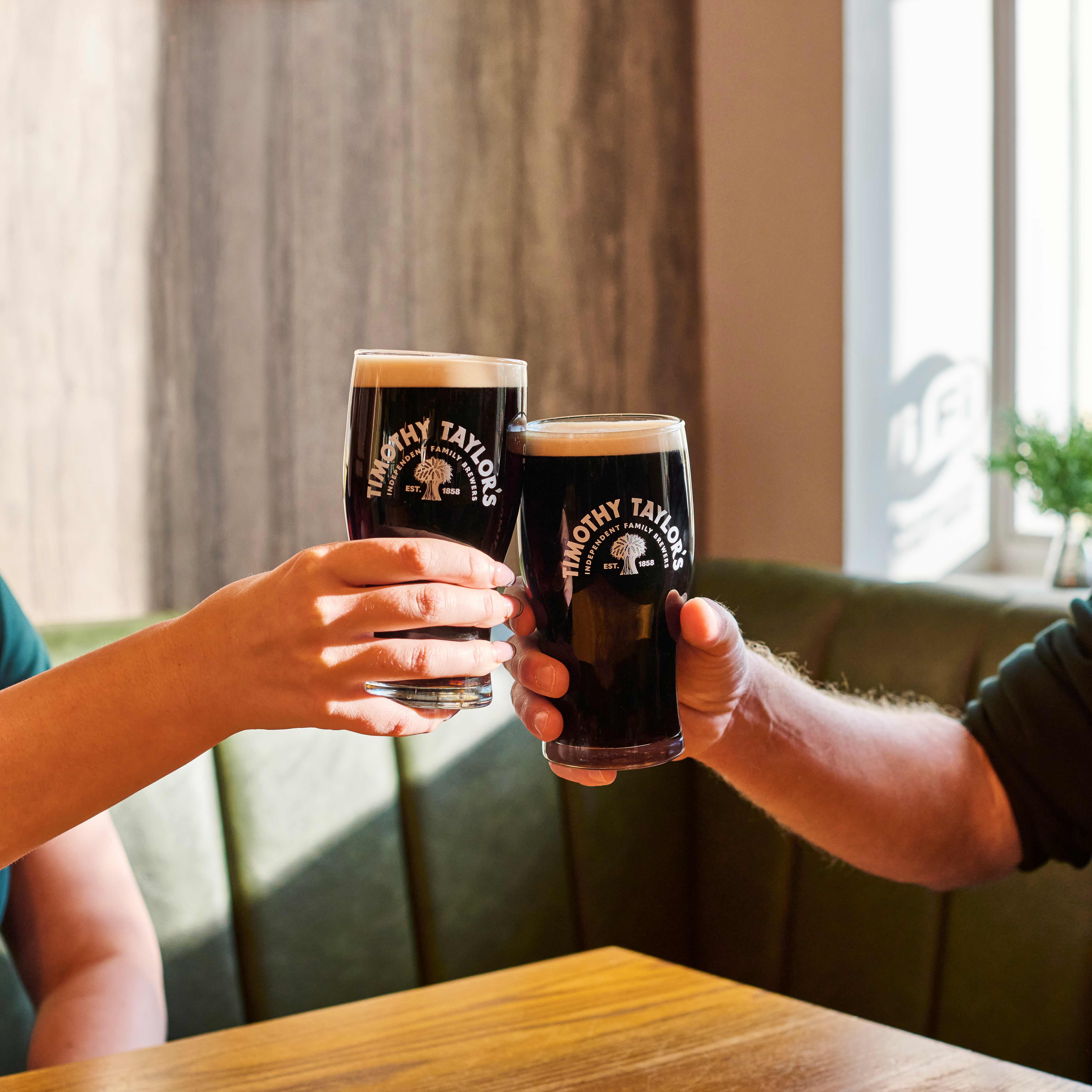 Pint of Timothy Taylor’s Stout with a creamy white head.