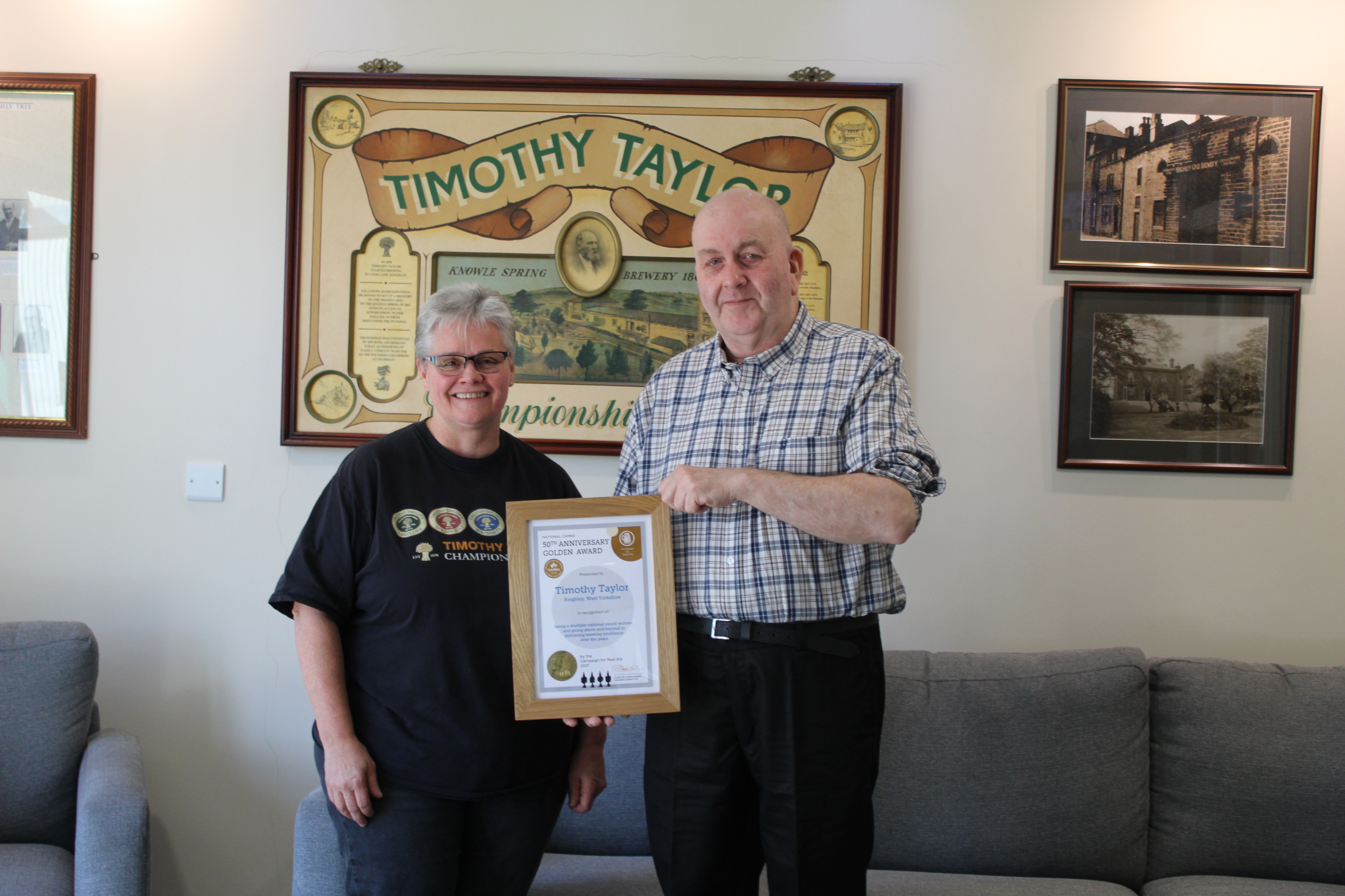 Timothy Taylor's POS & Sales Support Manager and CAMRA member, Colleen Holiday, being presented the Golden Award by CAMRA’s Yorkshire Regional Director, Kevin Keaveny