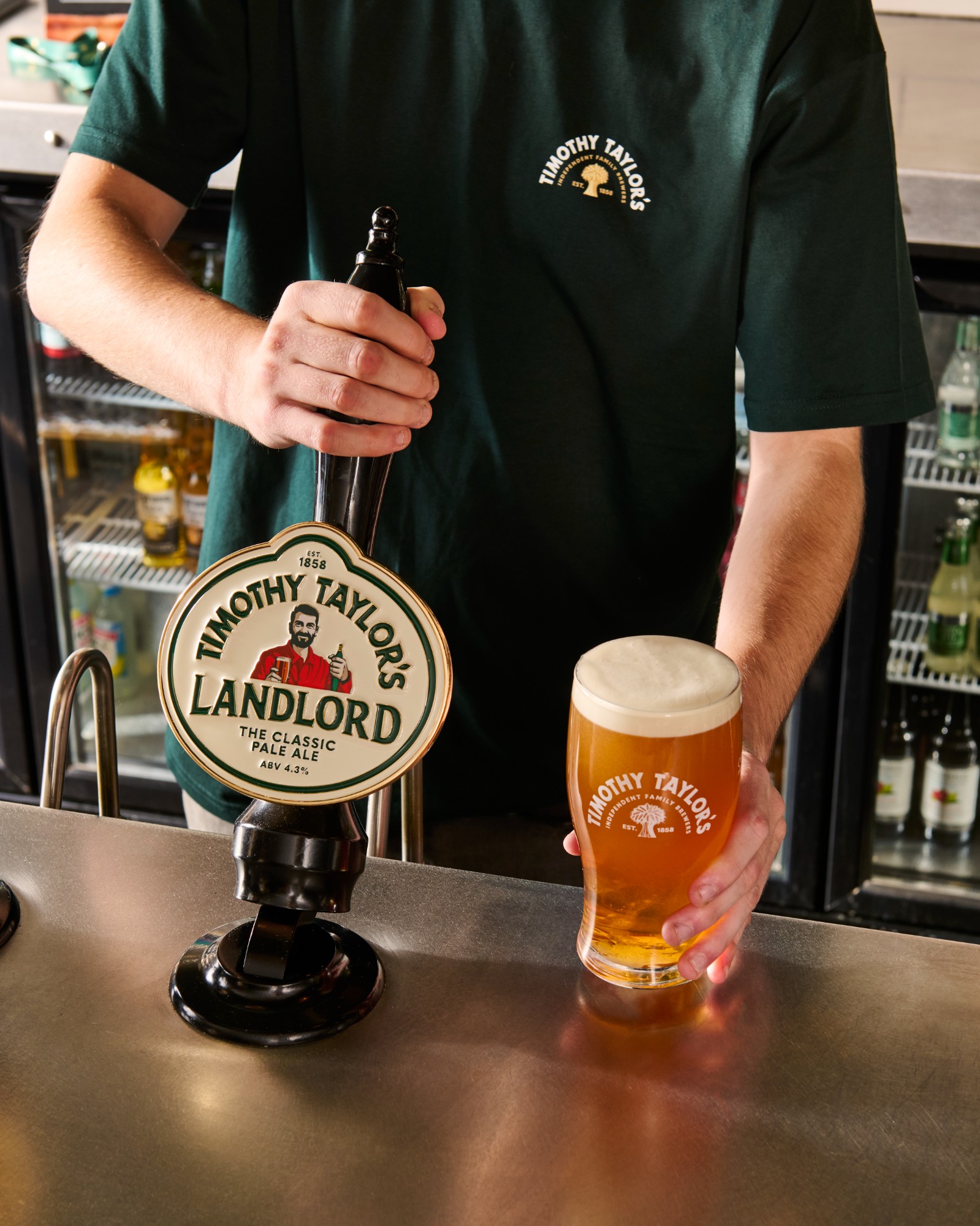 A pint of Timothy Taylor’s Landlord beside its refreshed pump clip